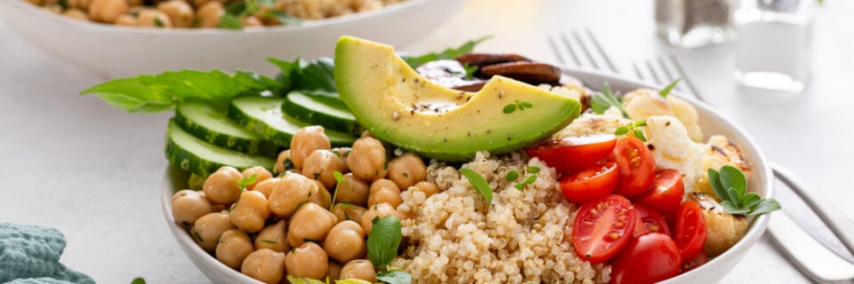 Healthy high protein vegan plant based lunch bowl with mushrooms, roasted cauliflower, herbed chickpeas and quinoa