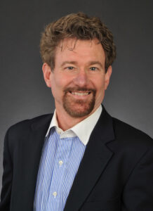 Man in suit smiling